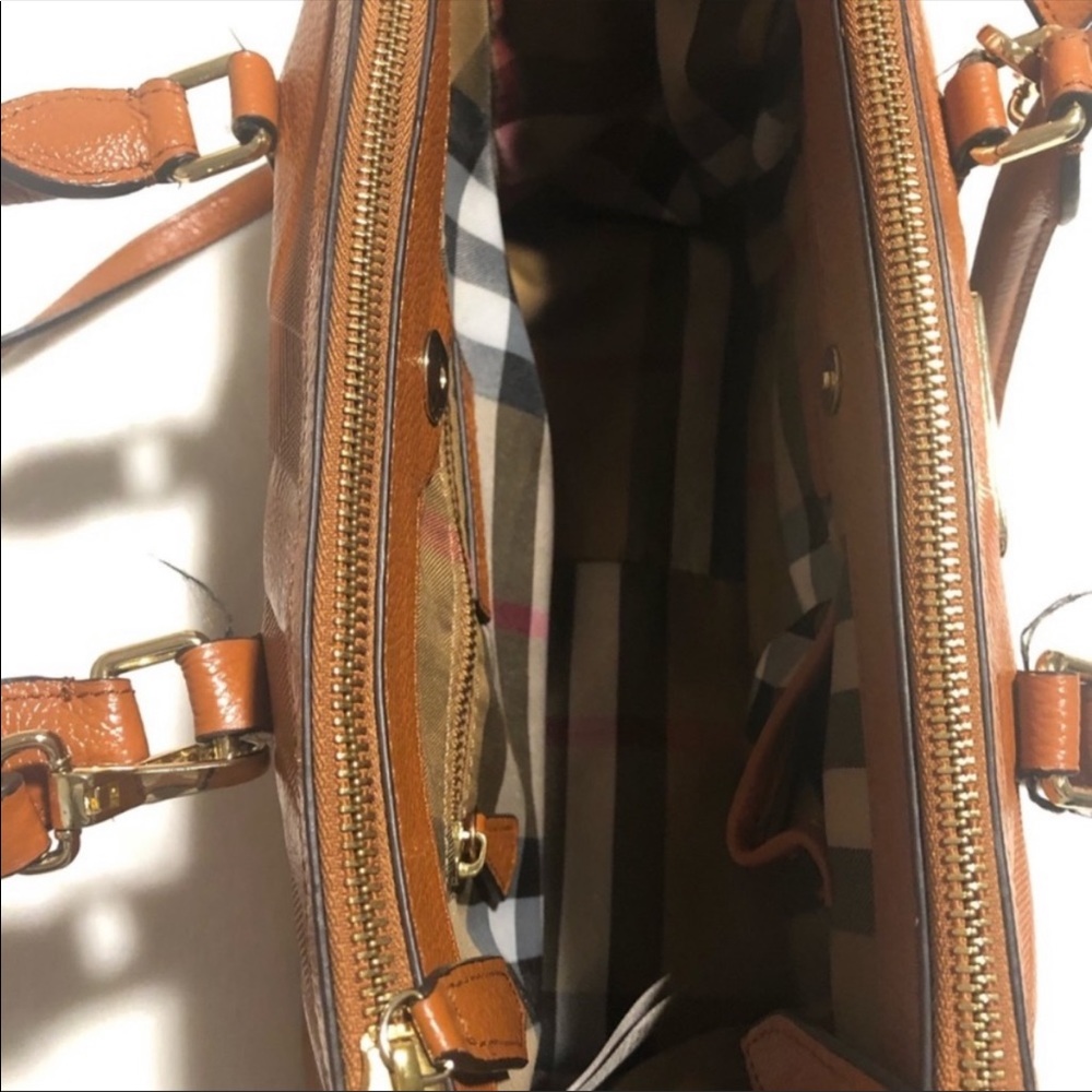 Large Burberry cognac crossbody purse.